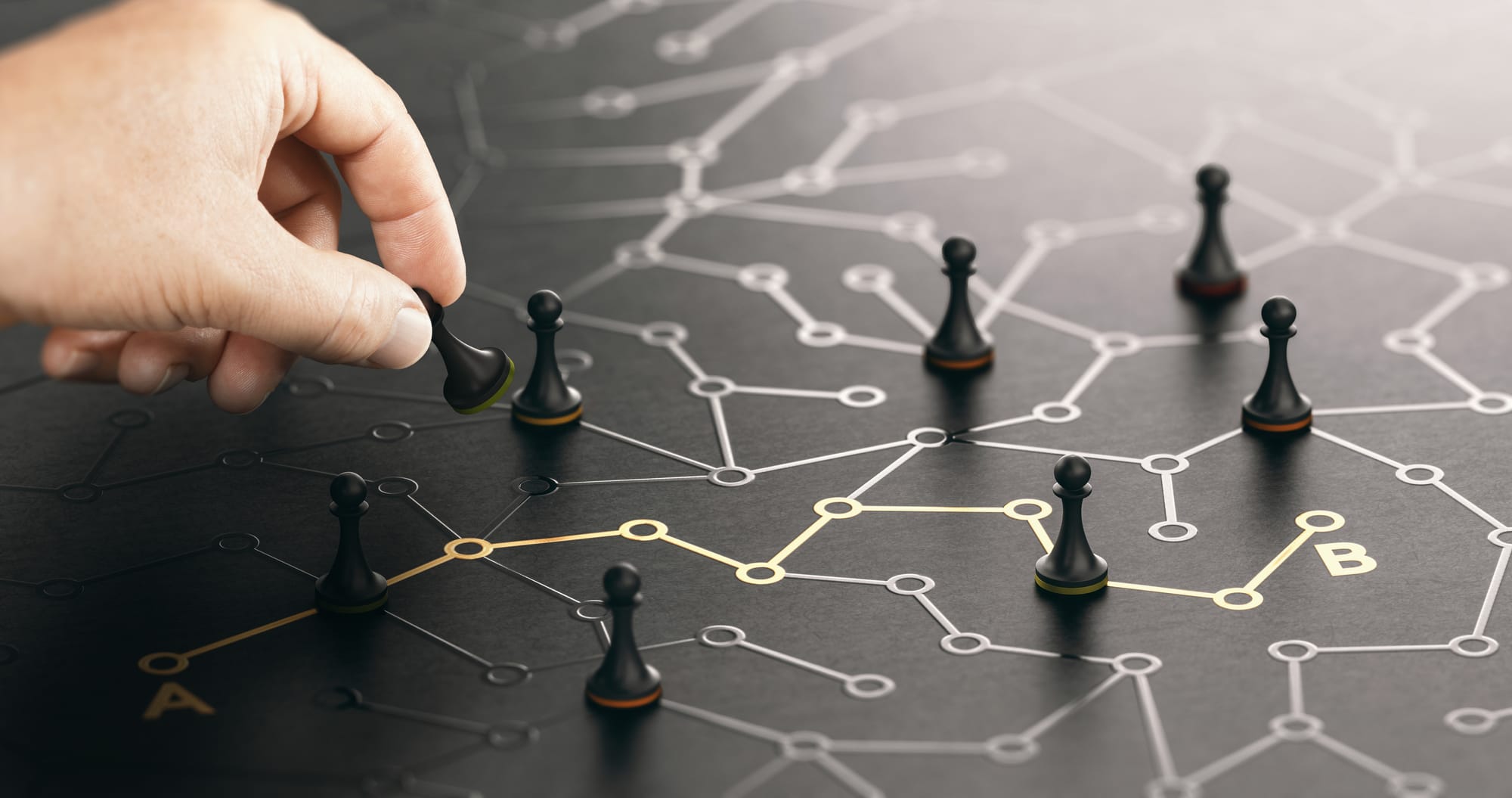 Chess pawns on a network board, one path highlighted in gold